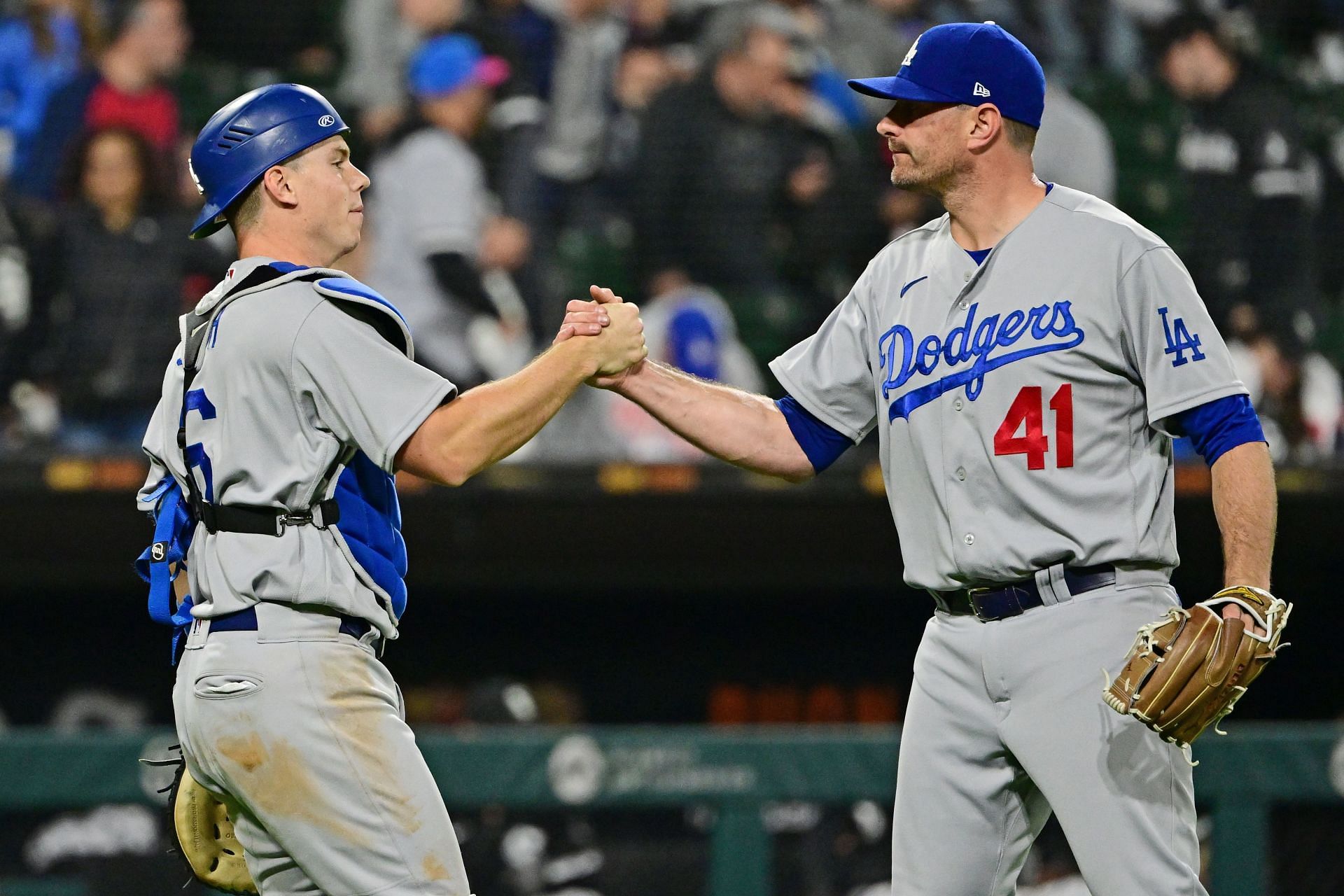 Pitcher Daniel Hudson (right) and catcher Will Smith (left) shake hands after a win over the Chicago White Sox.